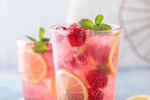 Spring or summer cold cocktail, raspberry lemonade photo