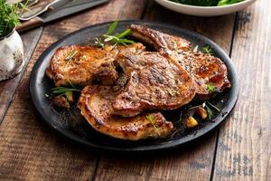 Grilled or pan fried pork chops on the bone photo