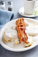 Biscuits and gravy with bacon for breakfast photo