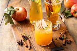 Variety of fall cocktails or mocktails made with apple cider photo