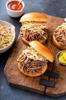 Pulled pork sandwiches with cole slaw on brioche buns photo