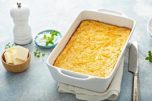 Cheesy cornbread freshly baked in a pan photo