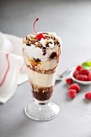 Ice cream, chocolate and whipped cream parfait photo