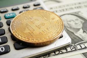 Golden bitcoin on US dollar banknotes money for business and commercial, Digital currency, Virtual cryptocurrency, blockchain technology. photo