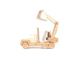 Photo of a wooden car dump truck made of beech on a white isolated background
