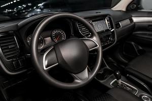 Interior view of car with black salon. Modern luxury prestige car interior photo