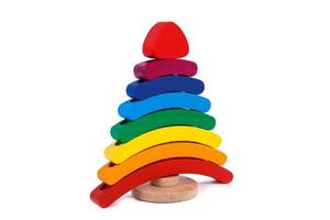 Photo colorful wooden constructor of small arcs, triangles and other forms of beech on a white isolated background