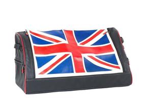 leather bag with flag UK for storing things and traveling in the trunk of a car on a white isolated background. Luggage, handmade suitcase photo