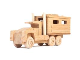 Photo of a wooden car truck made of beech on a white isolated background