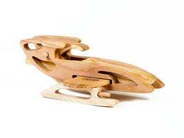 Photo of the a retro aircraft of beech. Toy made  plane of wood on a white isolated background