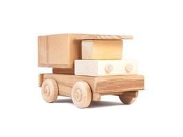 Photo of a wooden car truck made of beech on a white isolated background