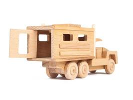 Photo of a wooden car truck made of beech on a white isolated background