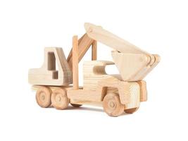 Photo of a wooden car truck  excavator made of beech on a white isolated background