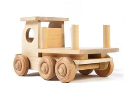 Photo of a wooden car dump truck made of beech on a white isolated background