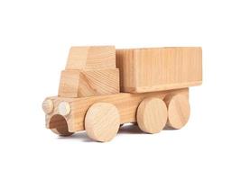 Photo of a wooden car truck made of beech on a white isolated background