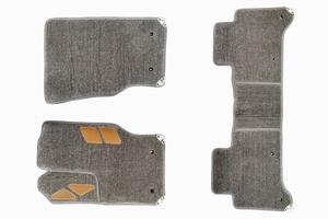 floor mats of carpet, velor for the front and rear seats of the car on a white isolated background, top view. photo