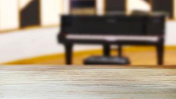 A wooden table with a blurred piano recital room background with an aesthetic interior atmosphere photo