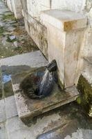 Old historic stone fountain photo