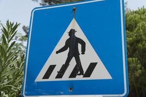 Sign on the road - Man crossing photo