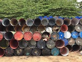Used oil drums that are not used and arranged neatly in 3 - 5 layers. no people. photo