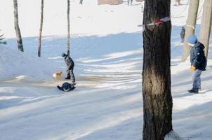 winter park with snow slides, walking in the park photo