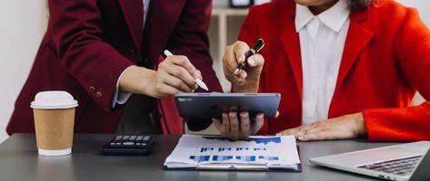 Business team present. Photo professional investor working new startup project. Finance meeting.Digital tablet laptop computer smart phone using, keyboard docking screen foreground,filter