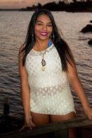 Lovely young Brazilian girl with a beautiful smile at the Park at Sunset photo