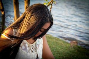 Lovely young Brazilian girl with a beautiful smile at the Park photo