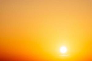 beautiful gradient orange clouds and sunlight on the blue sky perfect for the background, take in everning,Twilight photo