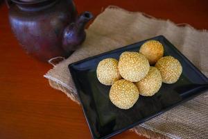 onde-onde or sesame ball or Jian Dui is fried Chinese pastry made from glutinous rice flour and coated with sesame seeds filled with bean paste. isolated on white background photo