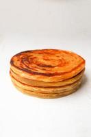 paratha bread or canai bread or roti maryam, favorite breakfast dish. isolated white background photo