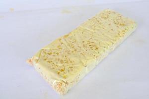 Raw tempeh or tempe. tempeh slices in white background. raw soybean seeds. Tempe is a traditional Indonesian food made from fermented soybeans. photo