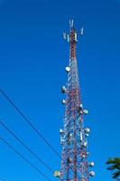 communication tower. Telco Trellis for 3G 4G 5G Apocalypse Internet Communication, mobile, FM Radio and Television Broadcasting On Air with Blue Sky in Background photo