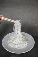 bihun or vermicelli or rice noodles or angel hair isolated on black background photo