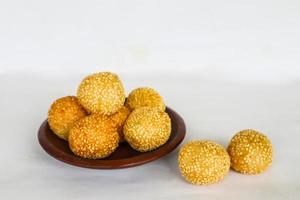 onde-onde or sesame ball or Jian Dui is fried Chinese pastry made from glutinous rice flour and coated with sesame seeds filled with bean paste. isolated on white background photo
