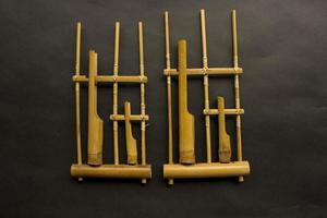 Angklung, the traditional sundanese musical instrument made from bamboo. Isolated on white background photo