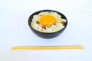 tamago kake gohan or raw egg on rice. traditional food from japan, eat on breakfast photo