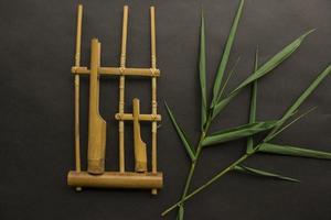 Angklung, the traditional sundanese musical instrument made from bamboo. Isolated on white background photo