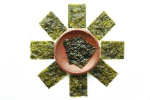 nori seaweed isolated on white background. Japanese food nori. Dry seaweed sheets. photo