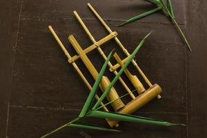 Angklung, the traditional sundanese musical instrument made from bamboo. Isolated on white background photo