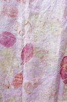 eco printing. Fragment of hand-dyed fabric using eco-print technique photo