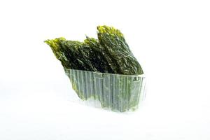 nori seaweed isolated on white background. Japanese food nori. Dry seaweed sheets. photo