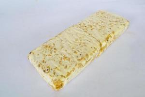 Raw tempeh or tempe. tempeh slices in white background. raw soybean seeds. Tempe is a traditional Indonesian food made from fermented soybeans. photo