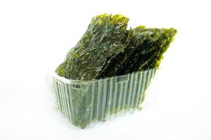 nori seaweed isolated on white background. Japanese food nori. Dry seaweed sheets. photo