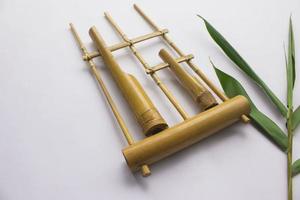 Angklung, the traditional sundanese musical instrument made from bamboo. Isolated on white background photo