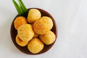 onde-onde or sesame ball or Jian Dui is fried Chinese pastry made from glutinous rice flour and coated with sesame seeds filled with bean paste. isolated on white background photo