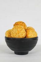 onde-onde or sesame ball or Jian Dui is fried Chinese pastry made from glutinous rice flour and coated with sesame seeds filled with bean paste. isolated on white background photo