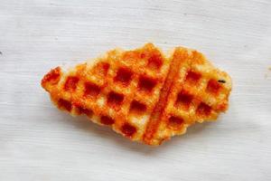 Croissant Waffle or Croffle with chocolate sauce served in box and white background photo