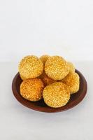 onde-onde or sesame ball or Jian Dui is fried Chinese pastry made from glutinous rice flour and coated with sesame seeds filled with bean paste. isolated on white background photo