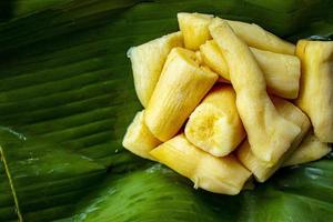 tapai or tape or peuyeum are traditional foods , snacks from indonesia, made from fermented cassava. Served on banana leaf photo